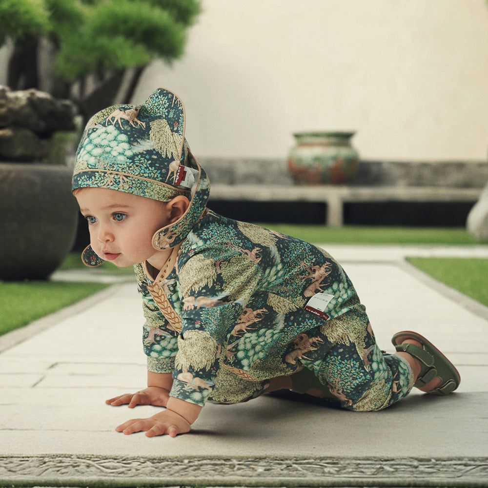Traditional Charm: Baby's Gentle Journey in Nature