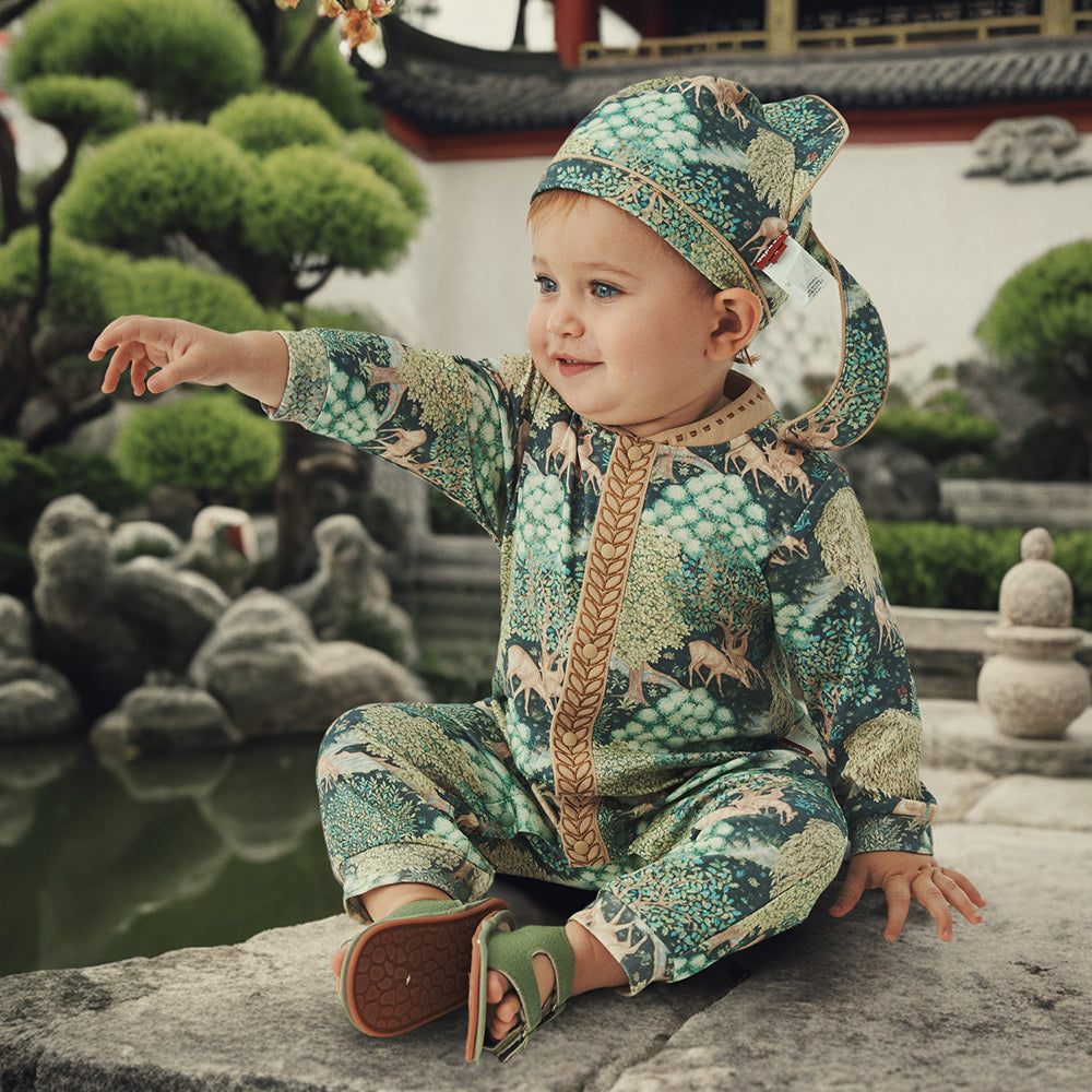 Traditional Charm: Baby's Gentle Journey in Nature